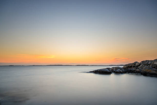 A beautiful sunset at sea with a lot of rocks