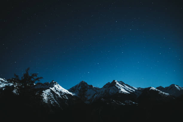 istock Night starry sky and Swiss Alps 1093158910