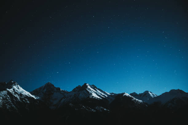istock Night starry sky and Swiss Alps 1093158916