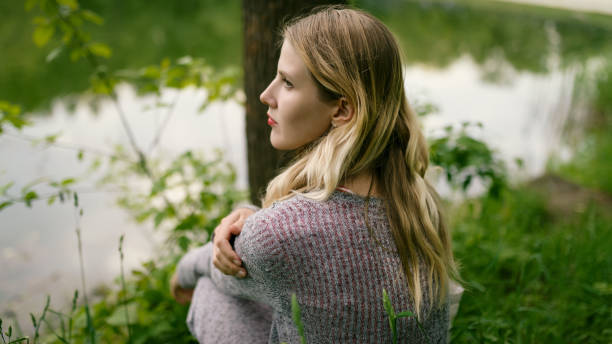 istock Young woman looks at the river. 1093161284