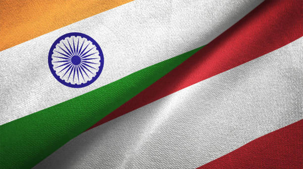 istock Austria and India two flags together textile cloth fabric texture 1093161692