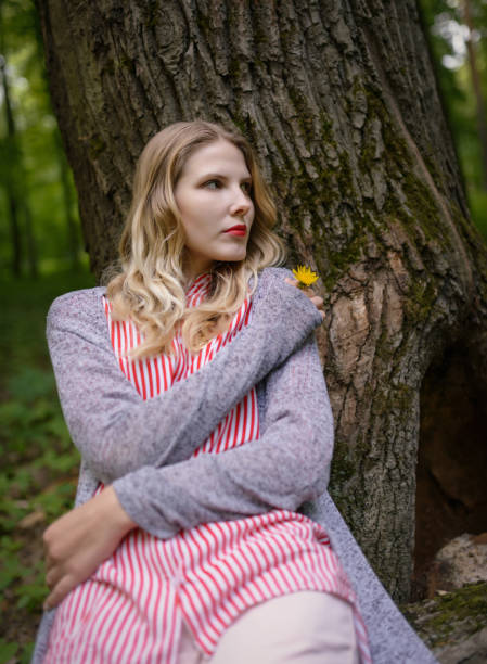 istock Woman in the forest with dandelion on her hand. 1093162010