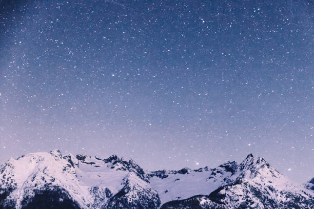istock Night starry sky and Swiss Alps 1093162278