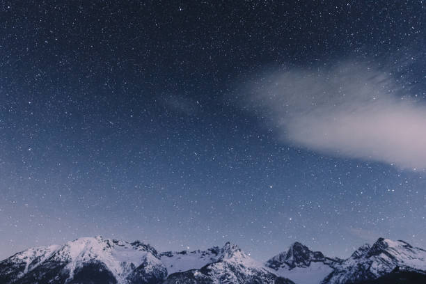 istock Night starry sky and Swiss Alps 1093162336