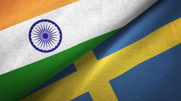 istock Sweden and India two flags together textile cloth fabric texture 1093163150