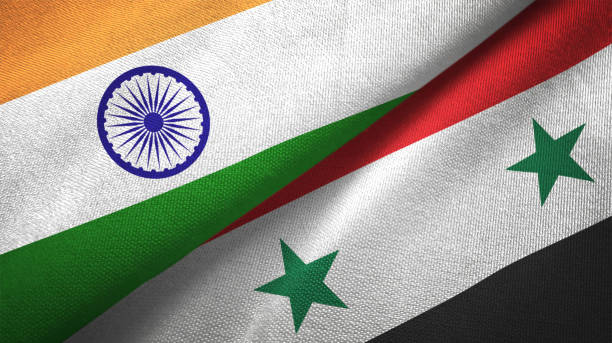 istock Syria Syrian Arab Republic and India two flags together textile cloth fabric texture 1093163154