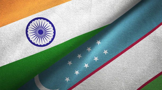 Uzbekistan and India two flags together textile cloth fabric texture