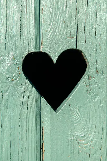 heart in a green wooden door
