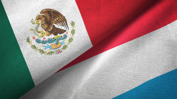 istock Luxembourg and Mexico two flags together textile cloth fabric texture 1093173134