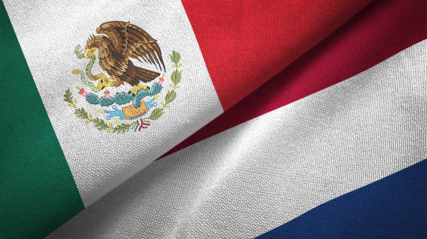 istock Netherlands and Mexico two flags together textile cloth fabric texture 1093173254