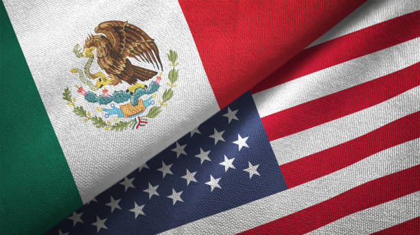 United States and Mexico two flags together textile cloth fabric texture United States and Mexico flag together realtions textile cloth fabric texture mexican flag stock pictures, royalty-free photos & images