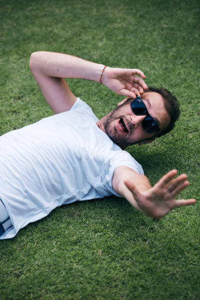 istock Man enjoying in summertime on a grass field. 1093184168