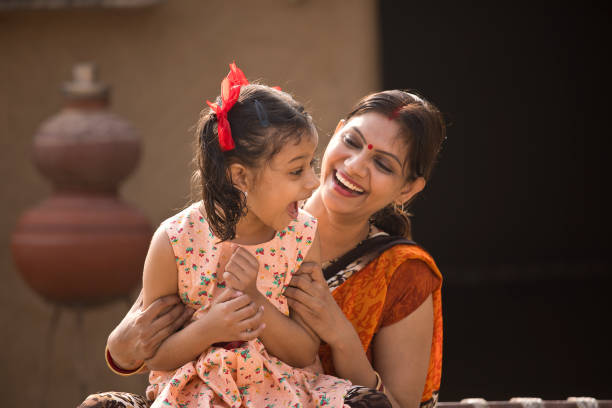 portrait of loving indian mother and daughter at village - day asian ethnicity asian culture asian and indian ethnicities imagens e fotografias de stock
