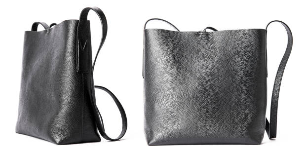 set of two Black leather Women's handbag on white background