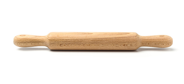 New wooden rolling pin for dough isolated on white background