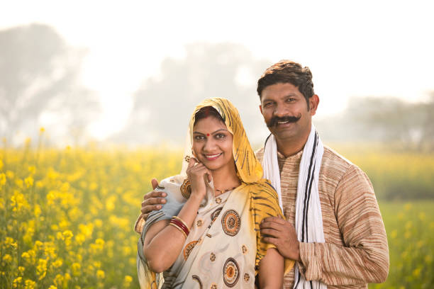 istock Rural couple standing in rapeseed field 1093192572