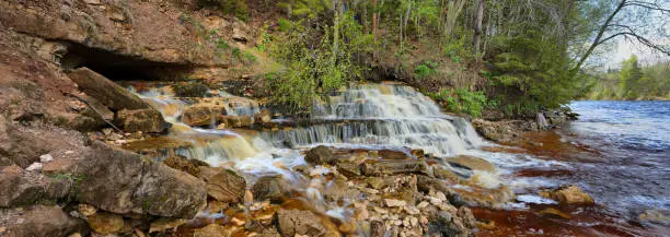 Photo of A small, picturesque waterfall by the river