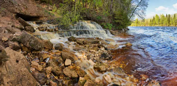 Photo of Rocky shore of the river and the waterfall