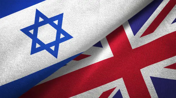 Photo of United Kingdom and Israel two flags together textile cloth fabric texture