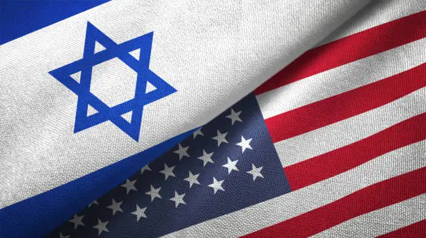 Photo of United States and Israel two flags together textile cloth fabric texture
