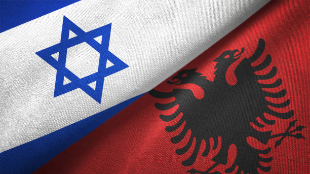 istock Albania and Israel two flags together textile cloth fabric texture 1093198026