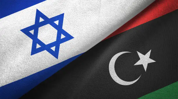 Photo of Libya and Israel two flags together textile cloth fabric texture