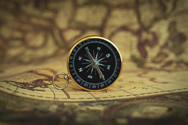 istock Compass on blur vintage map background, retro color tone, direction journey planning concept, blank space, top view, copy space 1093200026