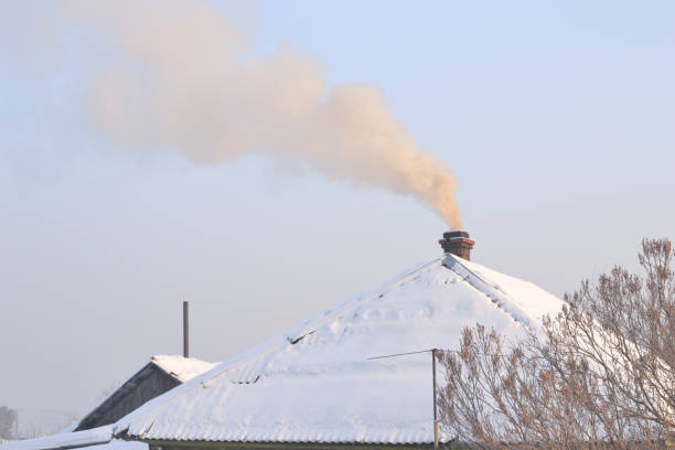 istock Yellow smoke rises from the chimney into the sky. 1093201716
