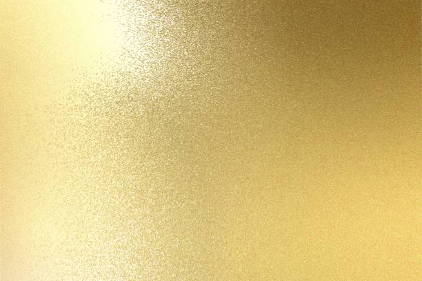 istock Light shining on brushed gold metal plate texture, abstract background 1093204600