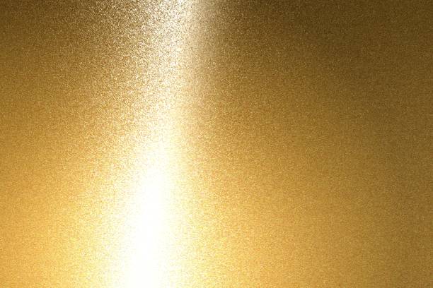 istock Light shining on brushed bronze metal plate texture, abstract background 1093204602