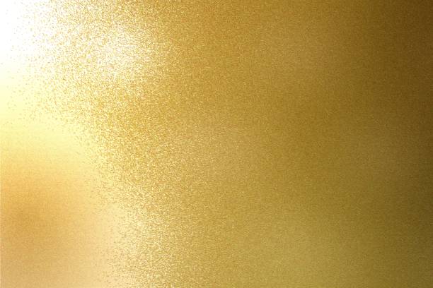 istock Light shining on rough gold metal sheet texture, abstract background 1093204610