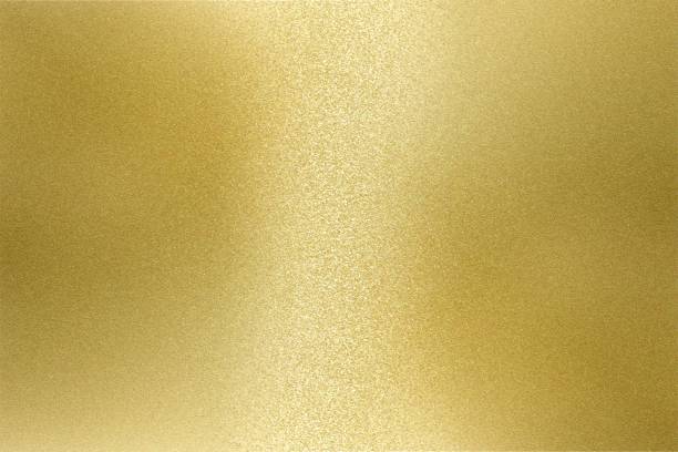 istock Light shining on rough gold metal wall texture, abstract background 1093204612