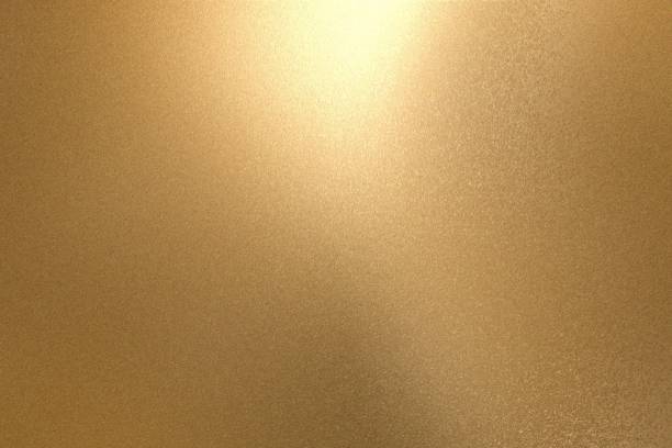 istock Light shining on rough gold metallic wall surfaces, abstract texture background 1093204646