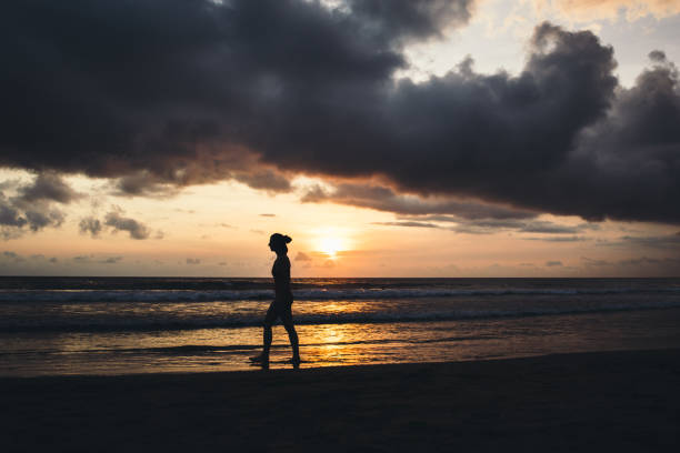 istock Woman meets sunset on Bali island 1093204840