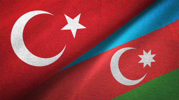 aserbaidschan und der türkei zwei fahnen zusammen textil tuch stoff textur - aserbaidschan stock-fotos und bilder