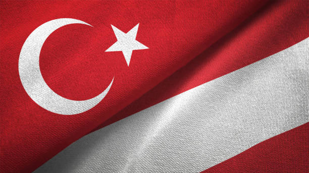 istock Austria and Turkey two flags together textile cloth fabric texture 1093207356