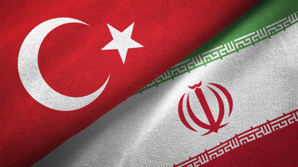 istock Iran and Turkey two flags together textile cloth fabric texture 1093208738
