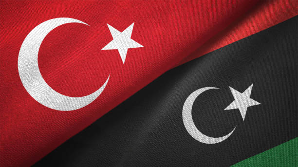 istock Libya and Turkey two flags together textile cloth fabric texture 1093208850