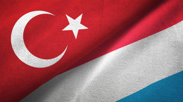 istock Luxembourg and Turkey two flags together textile cloth fabric texture 1093208864