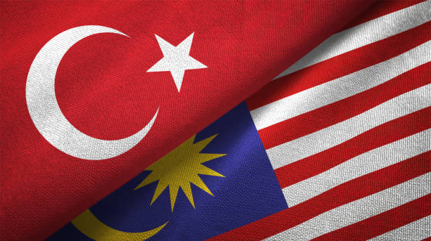istock Malaysia and Turkey two flags together textile cloth fabric texture 1093208900