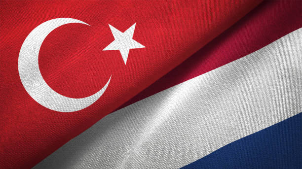 istock Netherlands and Turkey two flags together textile cloth fabric texture 1093208976