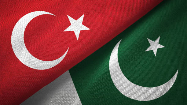 istock Pakistan and Turkey two flags together textile cloth fabric texture 1093209192