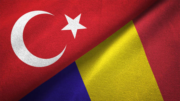 istock Romania and Turkey two flags together textile cloth fabric texture 1093209288