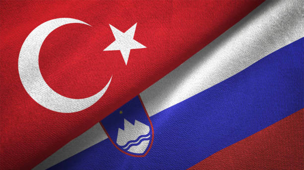 istock Slovenia and Turkey two flags together textile cloth fabric texture 1093209402