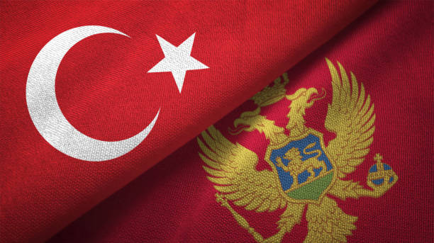 istock Montenegro and Turkey two flags together textile cloth fabric texture 1093209426