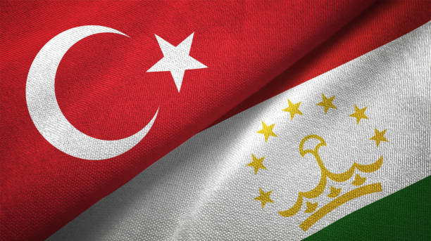 istock Tajikistan and Turkey two flags together textile cloth fabric texture 1093209476