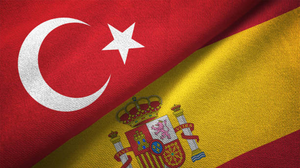 istock Spain and Turkey two flags together textile cloth fabric texture 1093209478