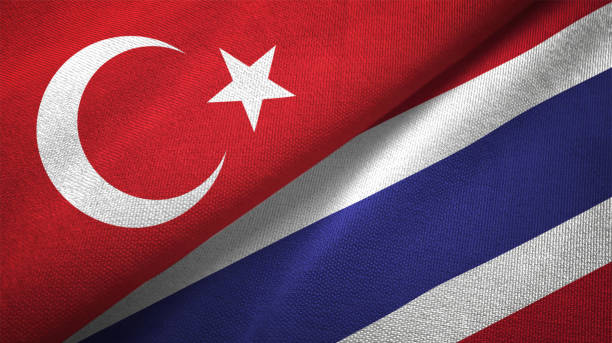 istock Thailand and Turkey two flags together textile cloth fabric texture 1093209480