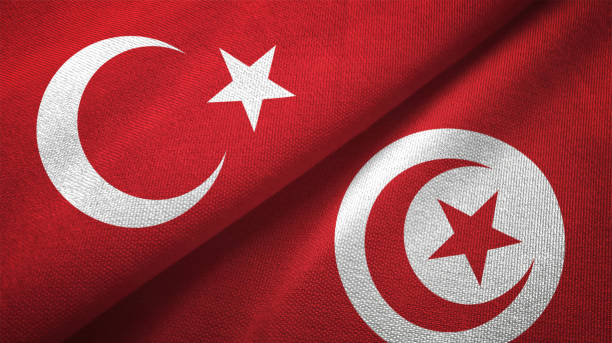 istock Tunisia and Turkey two flags together textile cloth fabric texture 1093209544