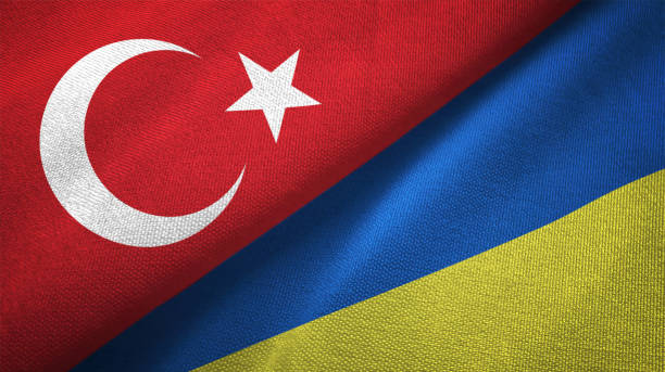 istock Ukraine and Turkey two flags together textile cloth fabric texture 1093209546